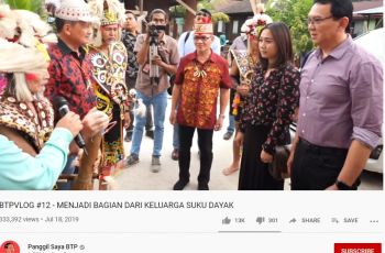 Puput Nastiti Devi dan Ahok dalam prosesi menjadi bagian keluarga suku Dayak . Tangkapan layar (Youtube/Panggil Saya BTP)